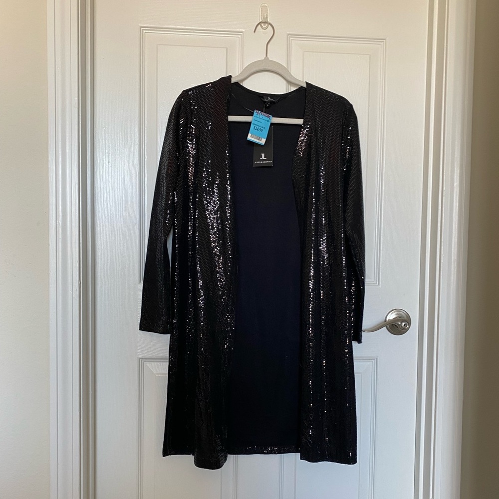 Sparkly black cardigan. New with tags. Size small.
